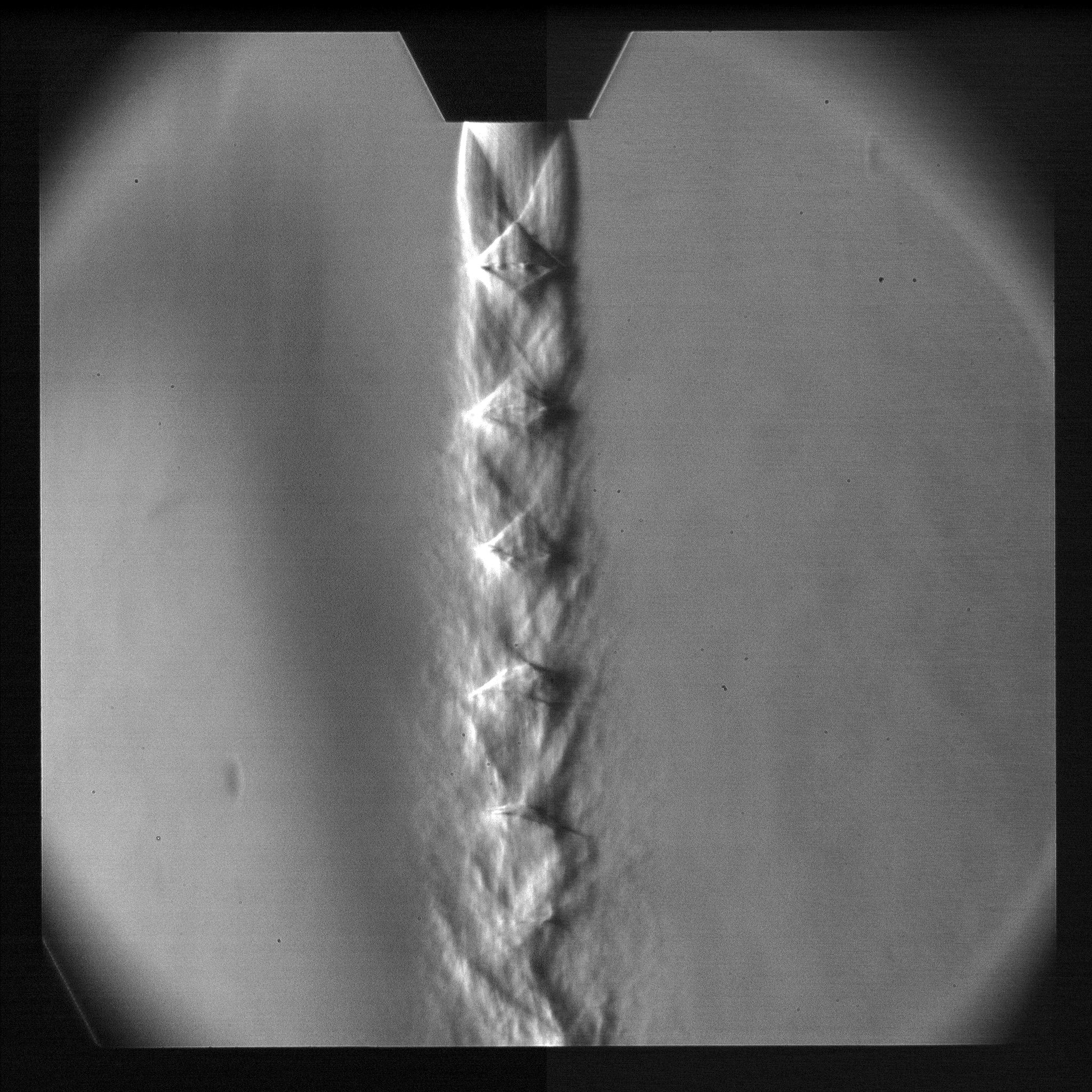 Schlieren image showing shock structure in particle-laden supersonic jet