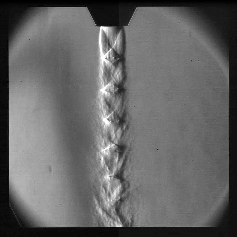 Schlieren image showing shock structure in a particle-laden supersonic jet